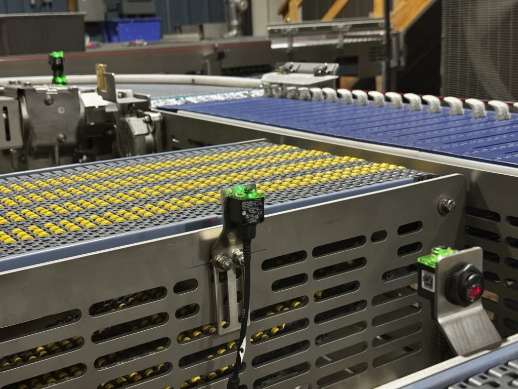 D&F Smart tech featuring photo-eyes strategically throughout conveyor system